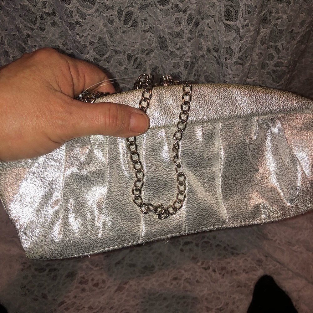 Vintage Fiorelli Silver Metallic Clutch with Chain. Satin like lining. Used